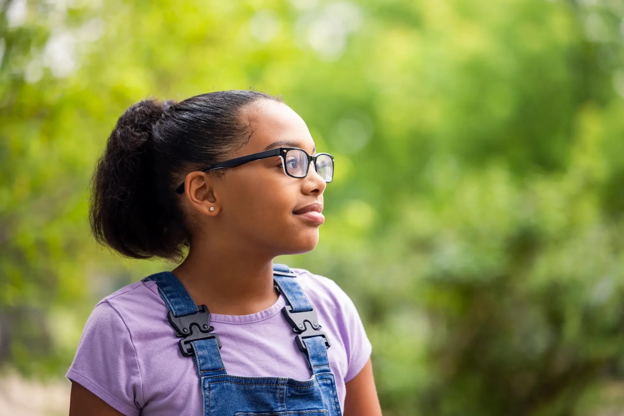 A student looking ahead outdoors